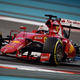 A photo of Sebastian Vettel driving the 2015 Ferrari F1 car.